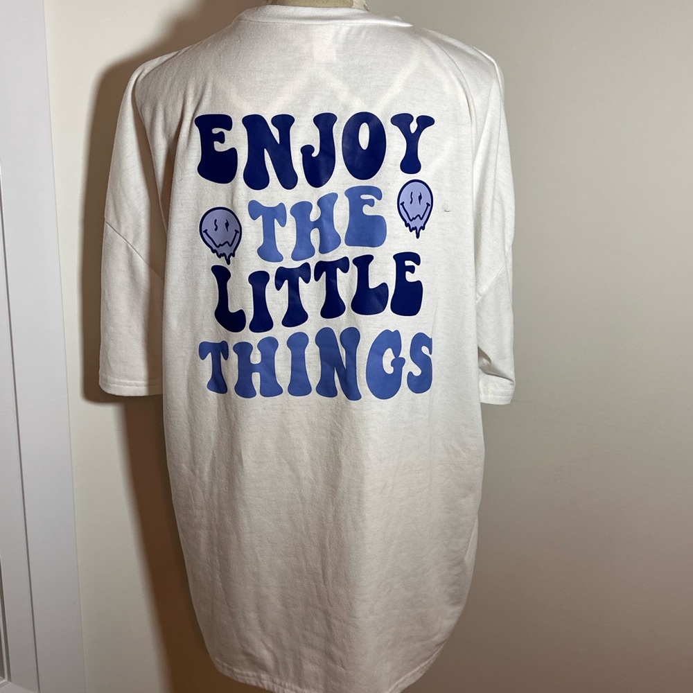 White graphic t shirt with blue writing